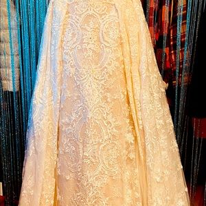 Beautiful wedding gown worn once dose need to be cleaned. Size 14 make offer